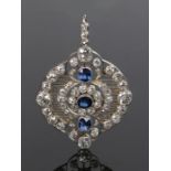 Diamond and sapphire set pendant, with three sapphires and a diamond surround set to white metal,