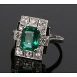Emerald and diamond set ring, with a central emerald and a diamond surround set to white metal,