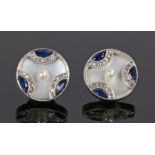 Pair of diamond sapphire and mother of pearl ear studs, of circular form, 14mm diameter