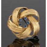 18 carat gold and sapphire brooch, the brooch formed from five interwoven bands with five