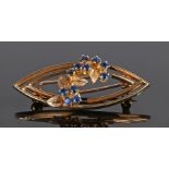 9 carat gold and sapphire set brooch, with a petal and sapphire bud design, 6.3 grams, 44mm diameter