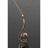 9 carat gold opal pendant and necklace the pendant formed from two scrolling bands terminating in an
