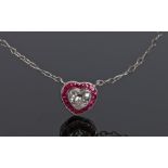 Diamond and ruby set pendant necklace, the heart cut diamond with a ruby surround, 9mm diameter