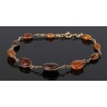 18 carat gold and amber set bracelet, with graduated amber beads, 19.5cm long