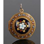 Victorian 18 carat gold and enamel pendant locket, the circular locket with foliate enamel