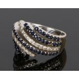 18 carat white gold sapphire and diamond set ring, with five rows of sapphires and two rows of