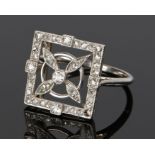 Art Deco diamond ring, the square head with flower head to the centre on white metal, ring size S,