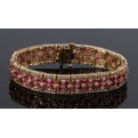 14 carat gold ruby and diamond set bracelet, with an estimated 6.16 carat of rubies and 4.2 carats