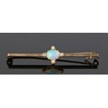 9 carat gold opal and diamond set brooch, the central opal with four diamonds to the surround,