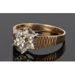9 carat gold diamond set ring, in the form of flower head set with diamonds, ring size K 1/2