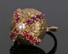 9 carat gold ruby and pearl set ring, the 'beehive' ring with a central pearl and four bands of