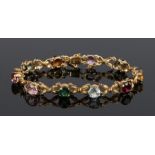 18 carat bracelet, set with multiple stones to the flower and petal links, 13.1 grams, 18cm long