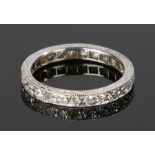 Diamond set eternity ring, with diamonds surrounding the shank at an estimated total weight of 0.