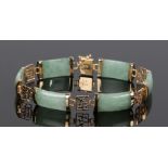 Chinese 14 carat gold and jade bracelet, formed from six jade panels interspersed with pierced
