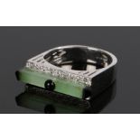 Modernist ring, set with a jade bar to the white metal shank, ring size P