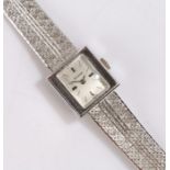 Bulova 14 carat white gold ladies wristwatch, the signed silver dial with baton markers, manual