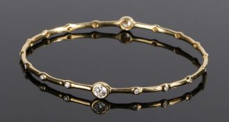 Ippolita 18 carat gold and diamond set bracelet, with two larger and sixteen smaller diamonds to the