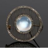Diamond and moonstone brooch, with a central cabochon moonstone and two bands set with diamonds,