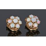 Pair of opal set ear studs, with seven opals forming a flower head, 10mm diameter