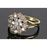 14 carat gold diamond set cluster ring, with one carat of diamonds set to the flower head, ring size