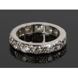 Diamond set eternity ring, with a row of round cut diamonds on white metal, ring size N