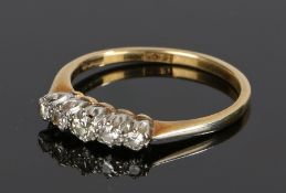18 carat gold diamond set ring, with five round cut diamonds to the head, ring size L