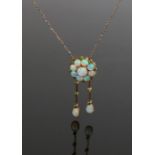 Opal set necklace, with a flower head design set with opals above opal drops with emerald set to the