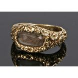 19th Century mourning ring, with a woven hair panel to the front and a scroll shank, an