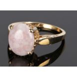 14 carat gold quartz set ring, with a cabochon cut quartz with a four claw mount, ring size N