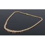 18 carat gold diamond set necklace, the petal design necklace with a total of 2.63 carats of
