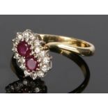 18 carat gold ruby and diamond set ring, with two rubies to the head and a diamond surround, ring