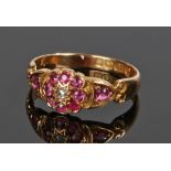 Antique ruby and diamond ring, the central diamond surrounded by a band of rubies and with a ruby to