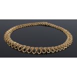 14 carat gold necklace, with graduated layered oval links, 69.15 grams, 29cm long