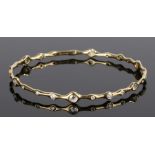 Ippolita 18 carat gold and diamond set bracelet, with undulating rows of different sized diamonds to