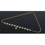 9 carat gold and moonstone set necklace, with a row of graduated cabochon cut moonstones, 47cm long