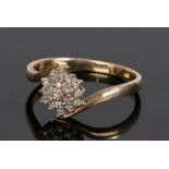 9 carat gold diamond set ring, with a diamond set flower head design, ring size P