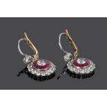 Pair of diamond and ruby earrings, the drops with a central diamond, ruby and diamond surround, 12mm