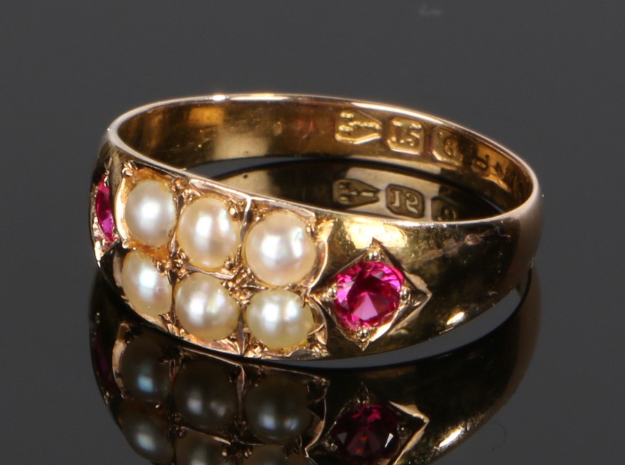 Antique 15 carat gold pearl and ruby ring, the two rows of three pearls flanked by a ruby to each