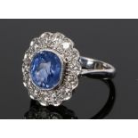18 carat white gold Ceylon sapphire and diamond set ring, the central certificated sapphire with