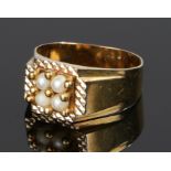 9 carat gold pearl set ring, with four pearls to the head, 3.4 grams, ring size P
