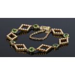 Peridot and Pearl bracelet with diamond shaped links set with pearls interspersed with peridot.