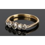18 carat gold diamond set ring, with five rose cut diamonds to the head, ring size O /12