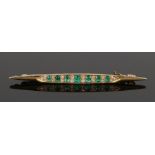 Emerald and diamond set brooch, set with an estimated 1 carat of emeralds and 0.54 carats of