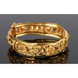 22 carat gold bracelet, with a flower and arch design to the bracelet, 66mm diameter, 28.6 grams