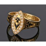 Victorian 18 carat gold and enamel mourning ring, the naivete head with a flower and pearl surround,