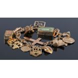 9 carat gold charm bracelet, with various charms to include a cross, a letter R, a carpet, a mosque,