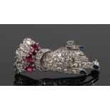 Diamond and ruby set brooch, in the form of a ladies hand with enamel finger nails, 29mm long