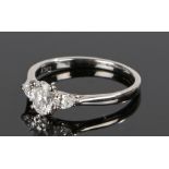 Platinum and diamond set ring, the head with a central, certificated, oval brilliant cut 0.54
