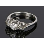 Platinum and diamond set ring with three round cut diamonds to the head, the central at 1.57 carat