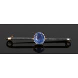 15 carat gold and sapphire set brooch, with a central round cut sapphire, the bar 50mm diameter 3.